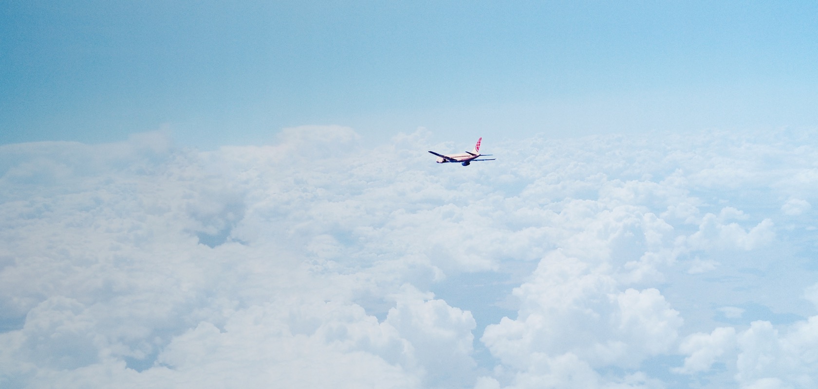 Plane flying above the clouds